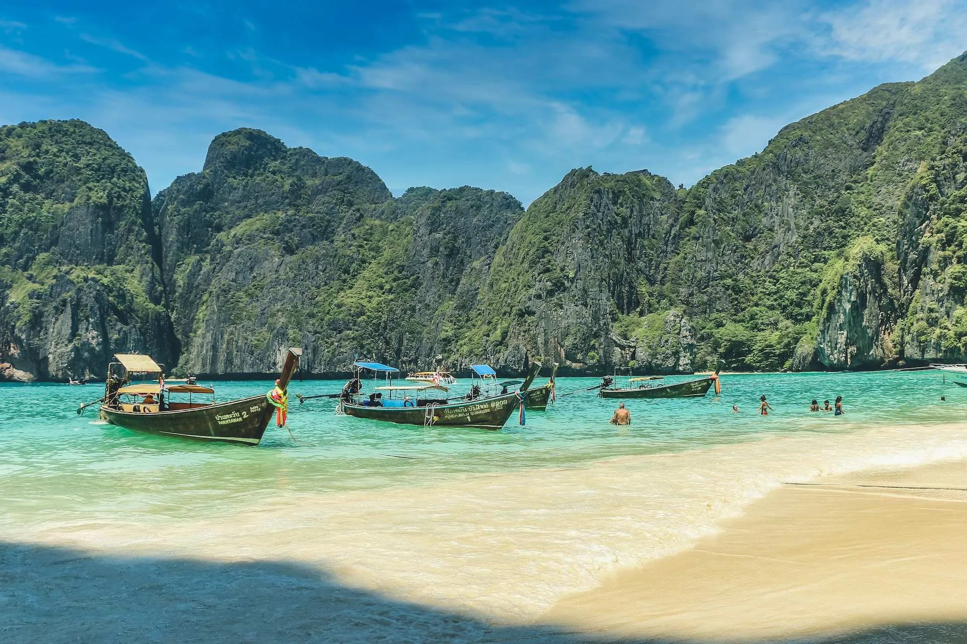 Island Exploration: Breathtaking Coastal Scene of Ao Nang with Fishing Boats